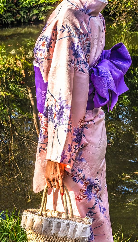 Colorful Japanese kimono with purple obi, Kiyomizu Buddhist Temple, Kyoto, Japan.